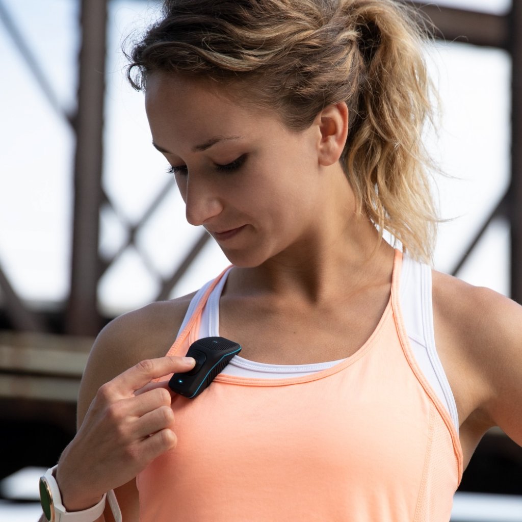 A woman wearing a 39g pink tank top.