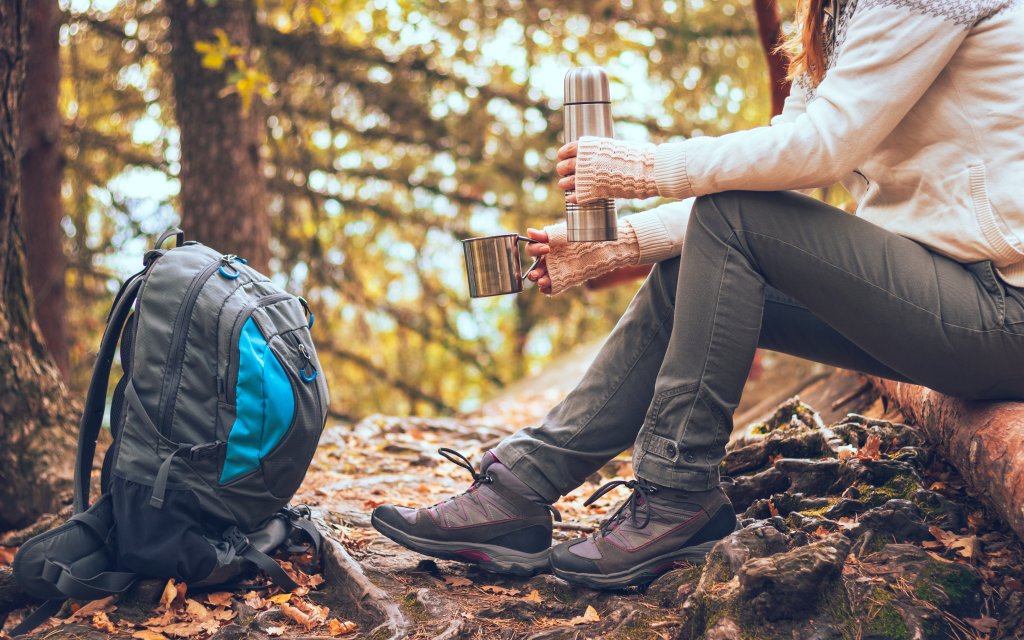 enable here to see a hiker enjoying a cup of mushroom tea