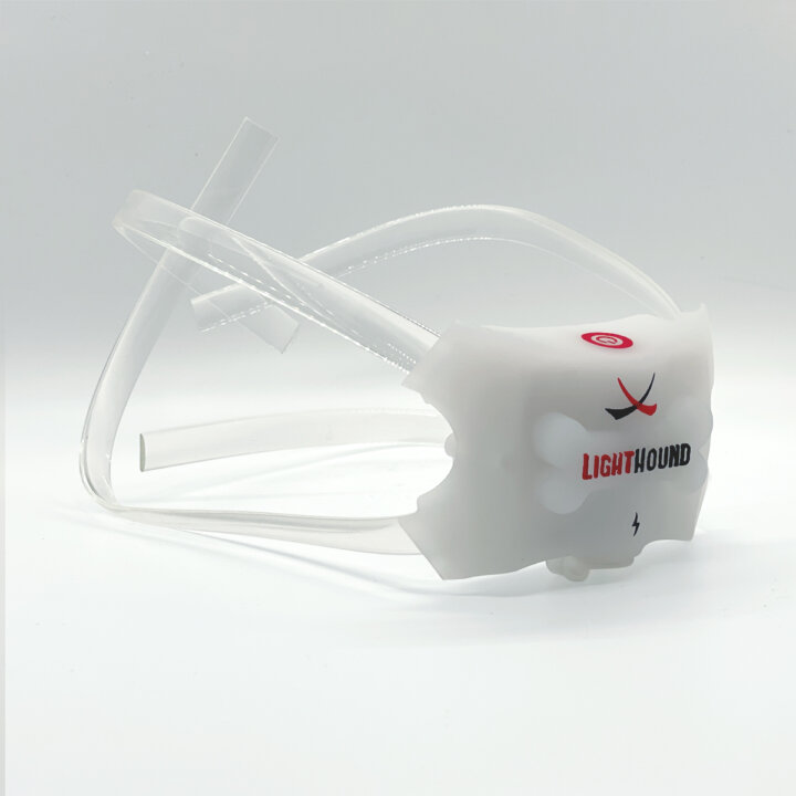 A white plastic device with a red and white LightHound Light Replacement logo on it.