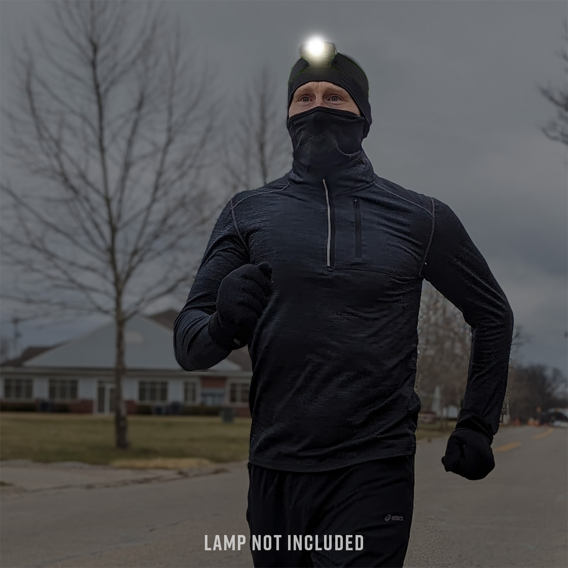 Man running with Noxgear head lamp.