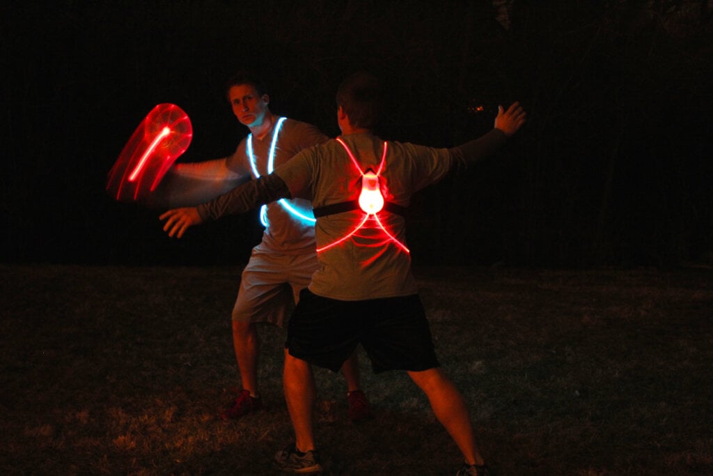 Simon and Tom play ultimate frisbee in the dark