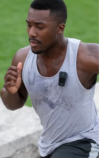 Photo of a man jogging wearing a 39g on his shirt.