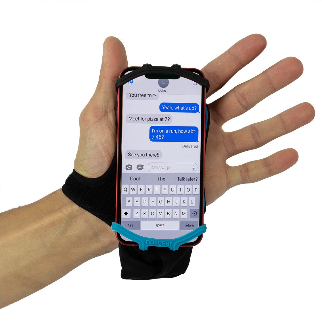 Phone holder on a hand showing a string of text messages.