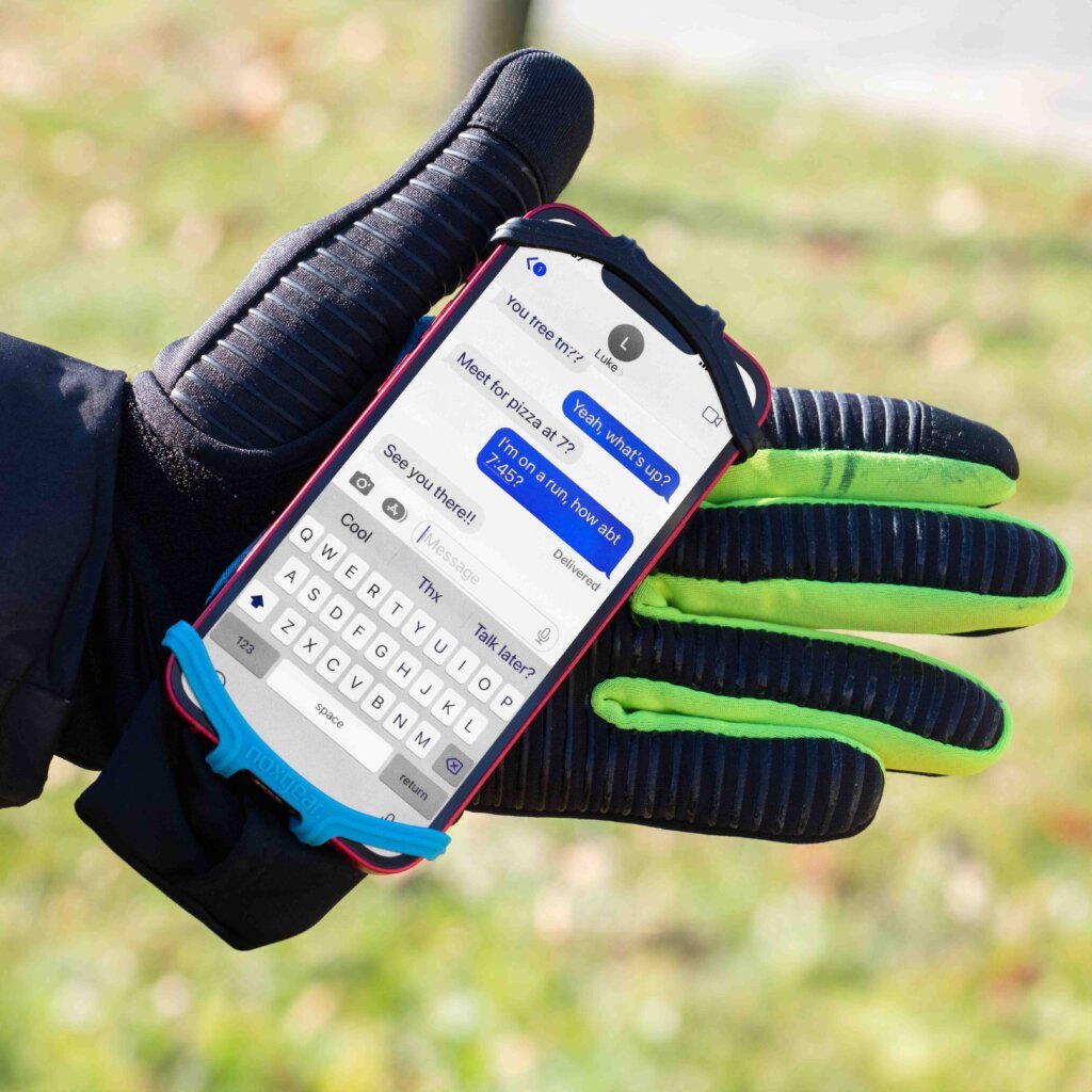 Noxgear Phone Holder on hand over a glove.